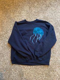 Hand sewn lettering, you can choose the color of the words and jellyfish! Blue Streetwear Sweatshirt With Embroidered Text, Blue Embroidered Text Sweatshirt For Streetwear, Blue Sweatshirt With Letter Embroidery For Fall, Blue Crew Sweatshirt With Embroidered Graphics, Blue Sweatshirt With Embroidered Text For Streetwear, Blue Embroidered Sweatshirt For Fall, Blue Letter Embroidery Sweatshirt For Fall, Blue Casual Sweater With Letter Embroidery, Blue Sweater With Letter Embroidery For Fall