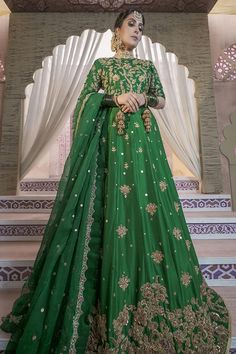 a woman in a green lehenga