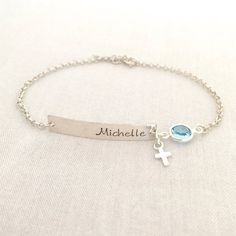 Hand Stamped Baby Boy Baptism Bracelet, Cross Jewelry, First Communion Gift, Baby Girl Bracelet, Christening Gift, Gift for Godchild♥ Now is available in 14K Rose Gold Filled♥ Available in Sterling Silver and 14K Gold Filled♥ Please be sure to drop a name and month of birthstone in the note box at checkout.♥ Specification. All component is Sterling Silver or 14K Gold Filled. Bar size 5 x 30mm. Cross size 4.4 x 7.2mm. Birthstone size 7mm. Thicker Rolo Chain. Comes in a satin pouch. Length include Personalized Cross Rosary Bracelet For Baptism, Silver Bracelet For Baptism Mother's Day, Adjustable Silver Name Bracelet For Baptism, Personalized Silver Name Bracelet For Baptism, Silver Name Jewelry For Baptism, Custom Name Silver Jewelry For Baptism, Boy Bracelet, Baptism Bracelet