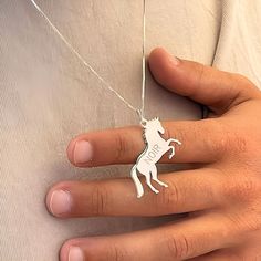 🐎 Personalized Engraved Horse Necklace - Custom Sterling Silver Gift for Horse Lovers 🐎 📏 Size & Materials Style: Engraved Horse Necklace Materials: 925 Sterling Silver, 24K Gold Plated, Rose Gold Pendant Size: 16mm x 30mm Thickness: 1.2mm / 0.05" Chain Style: Silver Box Chain Chain Length Options: 14-22" ✨ Celebrate the spirit of equestrian love with this stunning sterling silver Horse Necklace, complete with custom engraving! This personalized Racing Horse Pendant is the ideal gift for any Horse Design Pendant Necklace As Gift, Horse Design Pendant Jewelry Gift, Elegant Sterling Silver Jewelry With Horse Design, Personalized Silver 925 Stamped Jewelry, Racing Horse, Horse Pendant, Equestrian Gifts, Horse Necklace, Silver Horse