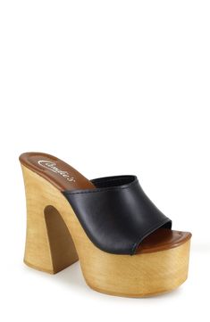 A woodgrain platform and soaring block heel lend scene-stealing height and retro-cool appeal to a slide sandal that will elevate your trendsetting looks. 4" heel; 2" platform Leather upper and lining/synthetic sole Made in Spain Party Clogs With Wooden Block Heel, Open Toe Wooden Platform Clogs, Wooden Open Toe Platform Clogs, Wooden Heels With Stacked Heel For Spring, Wooden Platform Open Toe Clogs, Summer Wooden Stacked Heel Heels, Summer Retro Platform Clogs, Retro Summer Platform Clogs, Wooden Open Toe Heels For Spring