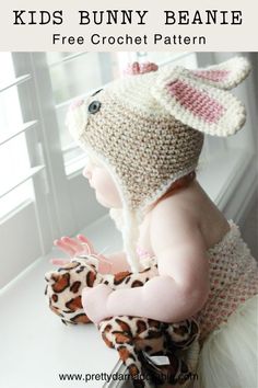 a baby wearing a bunny beanie sitting on top of a window sill with the words, kids bunny beanie free crochet pattern