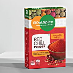 a box of red chilli powder sitting on top of a white table next to an orange bowl