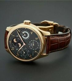 Elegant Brown Chronograph Watch, Elegant Round Watches With Date Display, Elegant Brown Formal Watch, Elegant Brown Watches For Formal Occasions, Brown Watches With Date Display, Formal Brown Watches With Date Display, Elegant Formal Watches With Date Display, Formal Brown Watch With Date Display, Iwc Portuguese