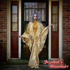 Elizabeth - Golden yellow toned light weight damask brocade dressing gown embroidered with hints of bronze, draped with multiple regal layers all trimmed in coordinating tassel and beaded trim, complete with a golden filigree crystalized clasp at a classy drop waist length. Perfect for dancers on stage or to complete your majestic fortune teller costume! Each dressing gown order comes packaged with a velvet flocked hanger so it doesn't slip off in your closet, and a garment bag for safe keeping Plus Size Burlesque Costume, The Empress Costume, Gold Burlesque Costume, Drag Outfits Fashion, Burlesque Gown, Art Nouveau Clothing, Fortune Teller Costume Diy, Scorpio Style, Insane Fashion