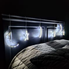 a bed that has some lights on it