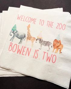 three napkins with animals on them and the words welcome to the zoo