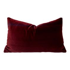 a red velvet pillow on a white background