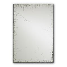 a mirror that is sitting on top of a white wall with an old fashioned frame