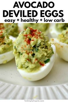 avocado deviled eggs on a white plate with the title overlay above it