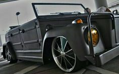 a black truck with chrome rims parked on the street