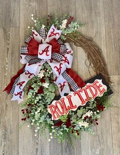 a wreath with the word rolli tide on it