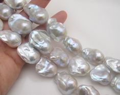 Material : Genuine Natural Baroque Pearls Quantity : One Full Strand - 15.5 inch (14-15 pcs per strand, depending on the pearl sizes) Color : Natural White in slightly silverish shade with very high luster Bead Shape : Irregular as pictured Bead Size : 15-18 x 22-30mm approx. Hole Size : 0.9mm approx. Lead Time & Shipping : This item will be shipped in 24 hours. If we offer FREE DOMESTIC shipping, package will be shipped via USPS First Class mail on orders shipping within the U.S.. D I S C O U N Handmade Pearl Jewelry, Bead Suppliers, White Pearl Earring, Bridal Earrings Pearl, The Pearl, Bridal Pearls, Pearl Stud Earrings, Jewelry Business