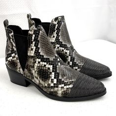 Show Off Your Rebelliously Good Taste In This One-Of-A-Kind Bootie Snakeskin Printed Synthetic Upper 4" Shaft Height Closed Almond Cap Toe With Metal Chain Link Toe. Pull-On Styling Wth Flexible Dual V-Cut Gore Panels Synthetic Lining Lightly Padded Footbed Man-Made Sole 2" Stacked Block Heel *New No Box Black Snake Print Boots For Fall, Trendy Gray Ankle Boots, Trendy Gray Pointed Toe Boots, Black Snake Print Ankle Boots, Gray Boots Medium Width For Fall, Open Toed Booties, Open Toe Ankle Boots, Comfortable Ankle Boots, Peep Toe Ankle Boots