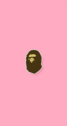 a pink background with a brown gorilla sticker on it