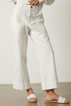 Inspired by the classic utility silhouette, we gave these cotton canvas pants a fresh take with a slim top and a flared leg, as well as a garment dye which shows off all the traditional details like patch pockets and over-sized belt loops. Canvas Pants, Velvet Tees, Flare Leg Pants, White Pants, Cool Fabric, Summer Essentials, Amazing Women, Wide Leg Pants, Casual Style