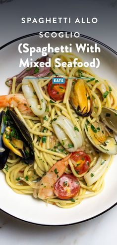 spaghetti with mixed seafood and clams on a white plate, text reads spaghetti allo scoglio spaghetti with mixed seafood