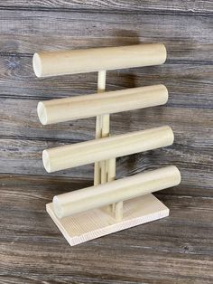 three wooden pegs are stacked on top of each other