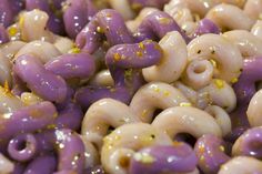 purple and white macaroni with yellow sprinkles