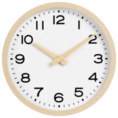 a white clock with black numbers on the face