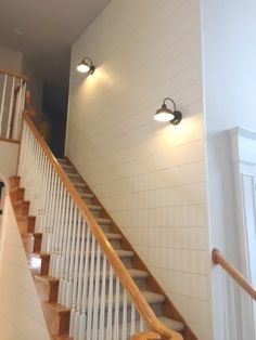 a stair case with two lights on each side