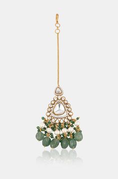 Elevate your style with this stunning maangtikka, expertly crafted with polki and cubic zirconia to create a traditional statement piece. The intricate design includes dangling green jade stones and pearls, adding a touch of elegance to any outfit. Perfect for enhancing your look with sophistication and charm, this maangtikka is a must-have accessory. Finish: 22KT Gold Plating Material: Silver, Copper Alloy, Polki, CZ Color: Green Size: One Size Closure Type: Hook Box Contains: 1 Maangtikka Hand Jewelry Rings, Chain Braid, Jade Stone, Hand Jewelry, Anklet Jewelry, Green Jade, Charm Gift, Intricate Design, Jade Green