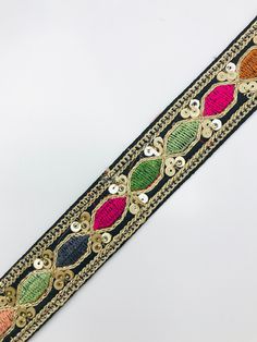 a close up of a belt with beads on it