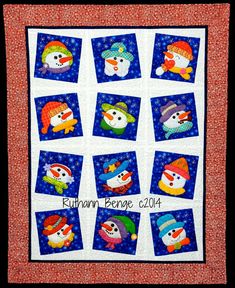 a quilted wall hanging with snowmen on it