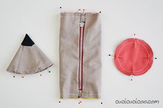 two pieces of fabric next to each other with sewing tools on the top and bottom