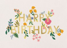 the words happy birthday written in gold foil with flowers and leaves on white paper background