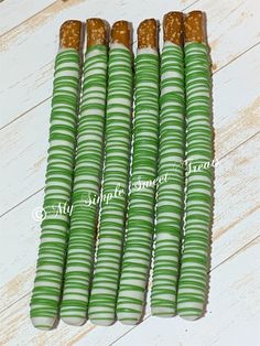 four green and white striped paper straws