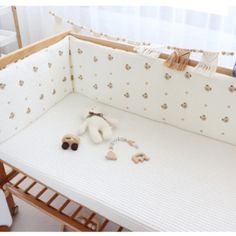 a baby crib that has stuffed animals on it