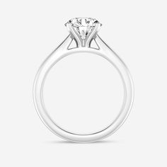 a white gold engagement ring with a single diamond