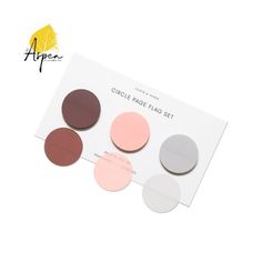 the circle paper pad set is shown in three different colors and has been placed on top of