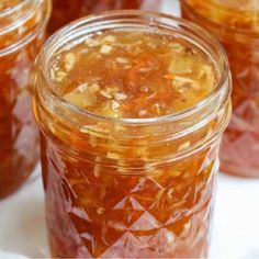 several jars filled with food sitting on top of a table