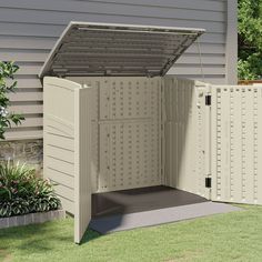 an outdoor storage shed with the door open