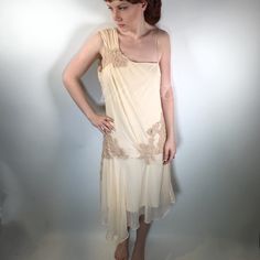 Foley + Corrina Silk Pale Creamy Pink Dress Foley was selling her own designs at a flea market & Corrina was selling vintage. They met & the collaboration brings us modern dresses w/vintage flow & feel. Here's a nod to a lady's dress of the 20's. Asymmetrical, cowl scoop back, hook & eye closure, light creamy pink. Body silk, lining poly & spandex. Apprx measurements laying flat ⚫️underarm-underarm: 18" ⚫️waist: 16" ⚫️hip: 18" ⚫️length: 43" Please compare measurements to similar garment. Meant to flow on body. Too loose on size 2 model. Foley + Corinna Dresses Vintage Summer Cocktail Evening Dress, Spring Evening Dress With Lace Trim, Vintage Sleeveless Summer Evening Dress, Beige Fitted Bodice Evening Dress For Spring, Cream Sleeveless Evening Dress, Sleeveless Summer Cocktail Vintage Dress, Spring Fitted Cream Evening Dress, Cream Fitted Evening Dress For Spring, Elegant Sleeveless Vintage Dress For Spring