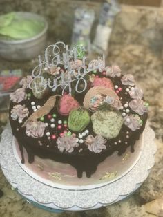 a chocolate birthday cake sitting on top of a table