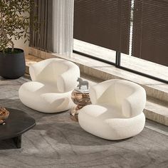 three white chairs sitting on top of a carpeted floor