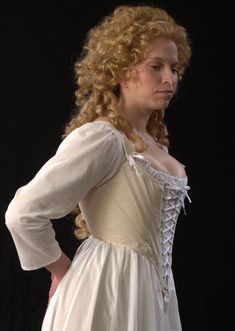 "Our c.1790 Marie is designed to be worn with the \"Round Gowns\" of the late eighteenth-century. Adjustable with both center front and center back lacings, the corset shapes in under the bust. The length is cut to sit above the waist, controlling the torso through the ribcage. The boning is firm 5/16\" steel. This corset has shoulder straps attached with adjustable front lacing. Features include: Ø Side seam alteration point for an adjustable fit Ø Center front and back lacing Ø Shoulder straps Corset 18th Century, 18th Century Stays, Ren Faire Costume, Lady Bird, Rib Cage, Marie Antoinette, Fashion Fabric, 18th Century, Art Reference