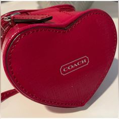 Coach Red Heart Pouch Jewelry Nwot $200 Size: 3 3/4" (L) X 3" (H) 13/4" (W) | Coach Coach Red Heart Pouch Jewelry Nwot Plastic Cover Still On Mirror Inside Drawstring Pouch Attached Interior Mirror Zip Closure 3 3/4" (L) 3" (H) 1 3/4" (W) Reposhing This Item I Purchased From @Lolaqueenz. Loved It, But Ready To Rotate For Something New. Questions? Leave A Comment Below! Coach Bags For Valentine's Day Gift, Coach Heart-shaped Bag For Valentine's Day, Interior Mirror, Mirror Interior, Plastic Cover, Coach Accessories, Drawstring Pouch, Red Heart, Something New