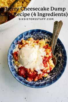 a blue bowl filled with dessert and topped with whipped cream next to a serving dish