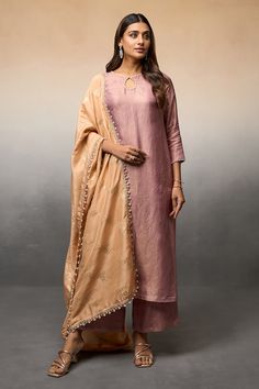 Pink shimmer finish straight kurta with pearl accents on the neckline. Paired with a matching pant and contrast peach dupatta with floral pattern and pearl danglers. - Aza Fashions Elegant Tussar Silk Palazzo Set With Zari Work, Elegant Tussar Silk Palazzo Set For Festivals, Elegant Cotton Silk Palazzo Set For Diwali, Elegant Palazzo Set With Self Design, Elegant Slub Silk Palazzo Set With Straight Kurta, Elegant Palazzo Set With Straight Kurta In Slub Silk, Elegant Cotton Silk Palazzo Set With Straight Kurta, Elegant Slub Silk Palazzo Set With Dupatta, Elegant Semi-stitched Slub Silk Palazzo Set