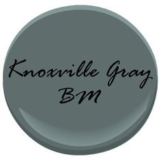 a gray button with the words knoavillee gay bm on it