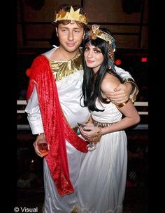 a man and woman dressed up in costumes