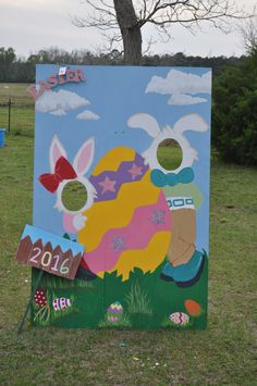 a painted sign in the middle of a field