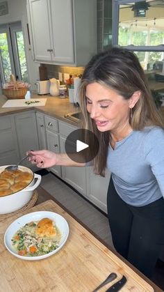 a woman standing in front of a bowl of food