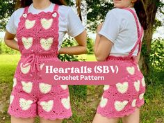 two girls wearing pink crocheted hearts overalls