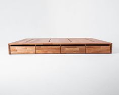 a wooden table with four drawers on it