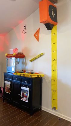 a room with a measuring tape on the wall